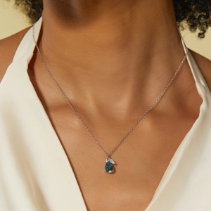 S925 silver necklace with green moss agate teardrop pendant worn by model