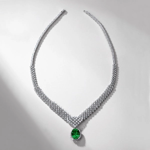 Luxurious S925 silver V-shaped necklace with a large oval emerald gemstone and pavé diamonds