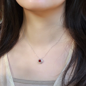 Luxurious S925 silver necklace featuring a square red ruby pendant worn on a model