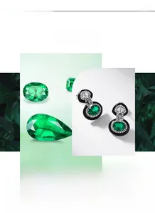 Macro shot of oval emerald stud earrings with black enamel trim and pavé white zircons