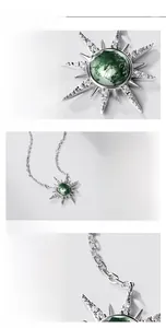 Detail of S925 silver sun necklace featuring green moss agate and moissanite inlay