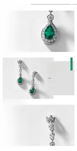 Detailed view of teardrop lab-grown emerald earrings in S925 sterling silver mounting