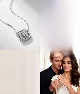 Close-up of geometric square pendant necklace and ring with sparkling lab-grown diamonds