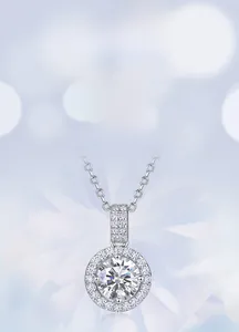 Close-up of a halo style pendant necklace with a brilliant round cut lab diamond center