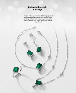 Detail of S925 silver jewelry set with emerald cut stones and white zircon accents