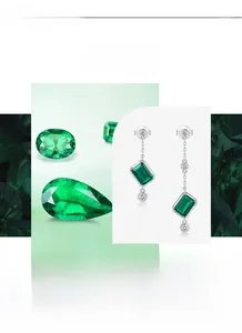 Macro detail of square emerald-cut green gemstones on S925 silver earrings