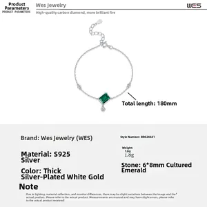 Macro detail of S925 silver bracelet with 6x8mm rectangle emerald and adjustable chain