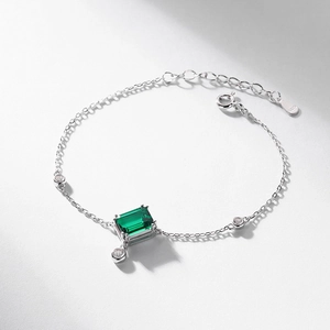 S925 sterling silver bracelet with emerald-cut green gemstone and cubic zirconia accents