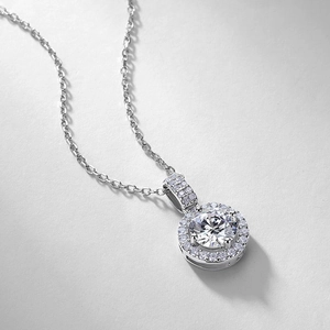 Elegant S925 silver necklace with a 1-carat round halo moissanite pendant on white background