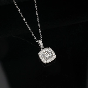 Macro shot of halo square pendant with lab-grown round diamond and fine silver chain