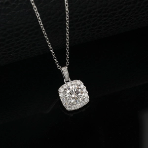 Macro view of a square halo pendant with a round lab diamond and micro-pave details