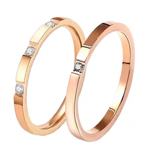 Polished rose gold stainless steel couple rings set with minimalist diamond inlay