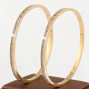 Polished titanium steel gold bangle set with sparkling zircon pavé for women