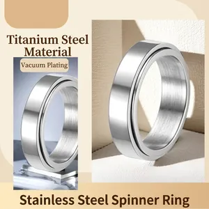 Polished silver stainless steel spinner ring with rotatable band for stress relief