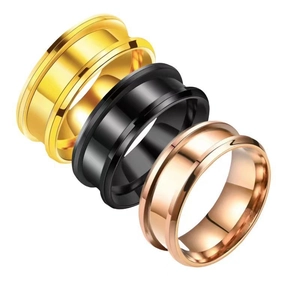 Polished stainless steel double-grooved rings in gold, black, and rose gold finishes