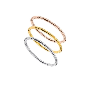 Three-piece titanium steel bead and cylinder bangles in rose gold, gold, and silver finishes