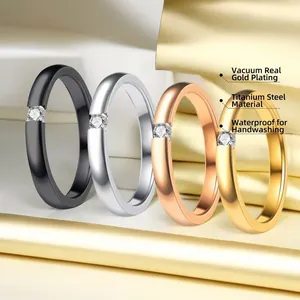 Three-color titanium steel rings set with single zircon in black, silver, and rose gold