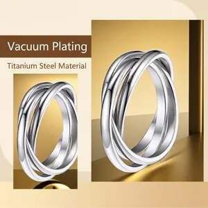 Three-band interlocking stainless steel spinner ring with durable vacuum gold plating