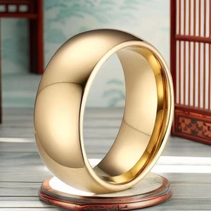 Macro shot of a chunky polished gold titanium ring displayed on a premium pedestal