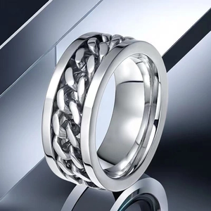 Silver stainless steel spinner ring featuring a Cuban chain inlay in a punk style