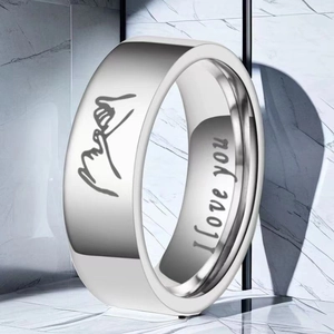 Macro detail of silver stainless steel ring with pinky swear icon and I love you engraving