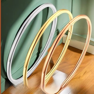 Minimalist 1mm stainless steel rings in gold, silver, and rose gold with waterproof finish