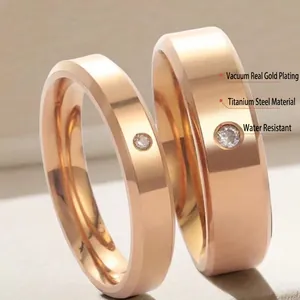 Titanium steel couple rings with rose gold finish and minimalist diamond setting