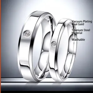 Polished titanium steel couple rings set with round cubic zirconia in silver finish