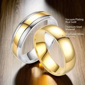 Polished gold and silver titanium steel rings on wood, waterproof vacuum plating set