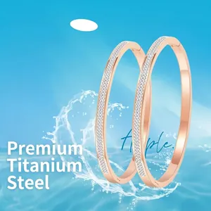 Polished titanium steel bangles with micro-pave cubic zirconia in 18k rose gold finish