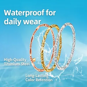 Three-color stackable stainless steel beaded bracelets in gold, silver and rose gold