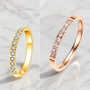 Titanium steel eternity band ring with micro-pave diamonds in gold and rose gold finish