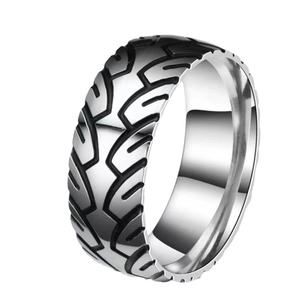 Industrial titanium steel ring featuring black etched tire tread pattern on silver metal