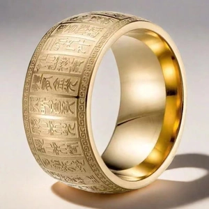 Macro shot of gold stainless steel ring with deep engraved Buddhist Heart Sutra script