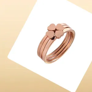 Polished rose gold clover rings made of titanium steel with a 3-in-1 stacked design