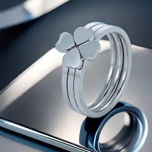 Three-layer silver titanium steel ring featuring a minimalist four-leaf clover design