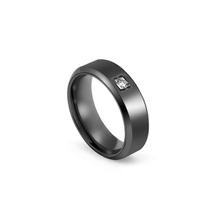 Close-up of matte black titanium steel ring with an inset square cubic zirconia stone