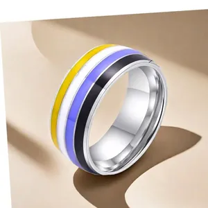 Stainless steel non-binary pride ring with yellow, white, purple and black enamel bands
