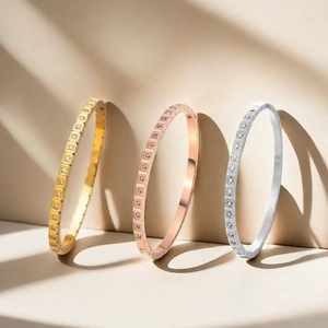 Three-piece geometric stainless steel bangles set in gold, rose gold and silver finish