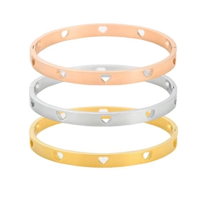 Brazaletes de acero de titanio con corazones calados en oro rosa, plata y oro