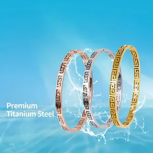 Three-piece set of titanium steel bangles with Greek key pattern in gold, silver, and rose gold