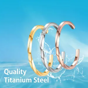 Three-piece twisted geometric titanium steel bangles in gold, silver, and rose gold