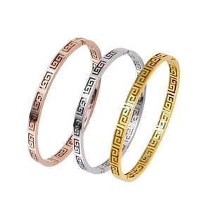 Three-piece stainless steel bangle set with classic Greek fret pattern in gold, silver, rose gold