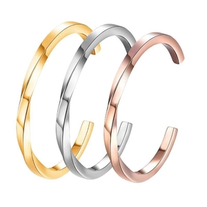 Three-piece geometric twisted bangles in gold, silver, and rose gold stainless steel