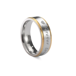 Two-tone stainless steel ring with Forever Love engraving and heart motif on white background
