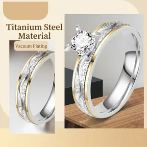 Two-tone titanium steel ring with six-prong zircon setting and vacuum plating finish