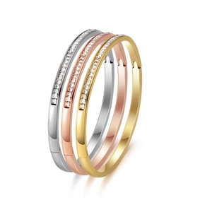 Three-piece stainless steel bangle set in silver gold and rose gold with pavé diamonds