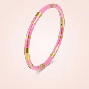 Pink and gold striped enamel bamboo style stainless steel bangle with hinged closure