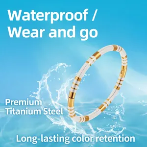 Waterproof gold and silver striped titanium steel bangle for women in blue water splash
