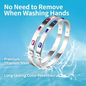 Polished stainless steel bracelets with pink and blue gemstones in a luxury bangles style